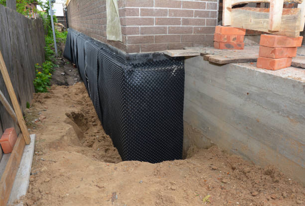 SJ Waterproofing Pros technician performing targeted Foundation Crack Repair assessment in Auburn, IN